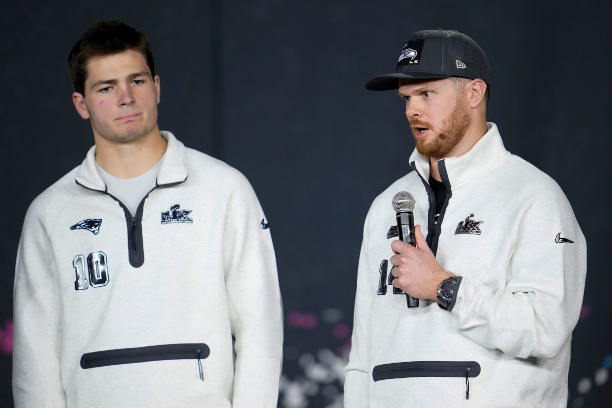 New England Patriots quarterback Drake Maye, left, and Seattle Seahawks quarterback Sam Darnold speak during the NFL Super Bowl Opening Night, Monday, Feb. 2, 2026, in San Jose, Calif. ahead of the Super Bowl 60 football game between the New England Patriots and the Seattle Seahawks. (AP Photo/Godofredo A. Vásquez)