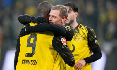 Dortmund's Serhou Guirassy, left, celebrates with Julian Ryerson after scoring his side's third goal during the German Bundesliga soccer match between Borussia Dortmund and FSV Mainz 05 in Dortmund, Germany, Friday, Feb. 13, 2026. (AP Photo/Martin Meissner)