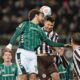 St. Pauli's Karol Mets, right, and Bremen's Jovan Milosevic in action during the Bundesliga soccer match between St. Pauli and Werder Bremen in Hamburg, Germany, Sunday Feb. 22, 2026. (Marcus Brandt/dpa via AP)
