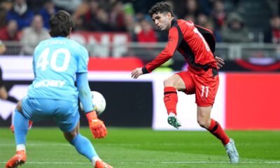 AC Milan's Christian Pulisic, right, in action during the Italian Serie A soccer match between AC Milan and Parma in Milan, Italy, Sunday, Feb. 22 , 2025. (Spada/LaPresse via AP)