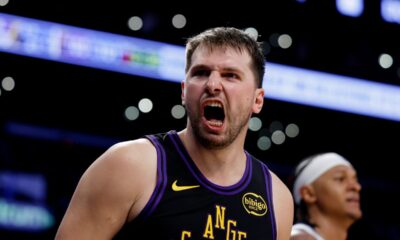 Los Angeles Lakers guard Luka Doncic (77) reacts after scoring during the second half of an NBA basketball game against the Orlando Magic, Tuesday, Feb. 24, 2026, in Los Angeles. (AP Photo/Caroline Brehman)