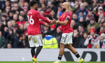 Manchester United's Amad Diallo, left, and Bryan Mbeumo react after a goal during the English Premier League soccer match between Manchester United and Tottenham in Manchester, England, Saturday, Feb. 7, 2026. (AP Photo/Jon Super)