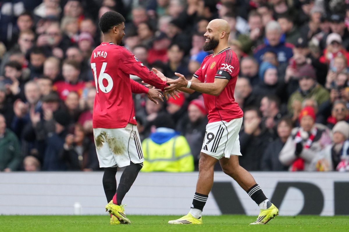 Manchester United's Amad Diallo, left, and Bryan Mbeumo react after a goal during the English Premier League soccer match between Manchester United and Tottenham in Manchester, England, Saturday, Feb. 7, 2026. (AP Photo/Jon Super)