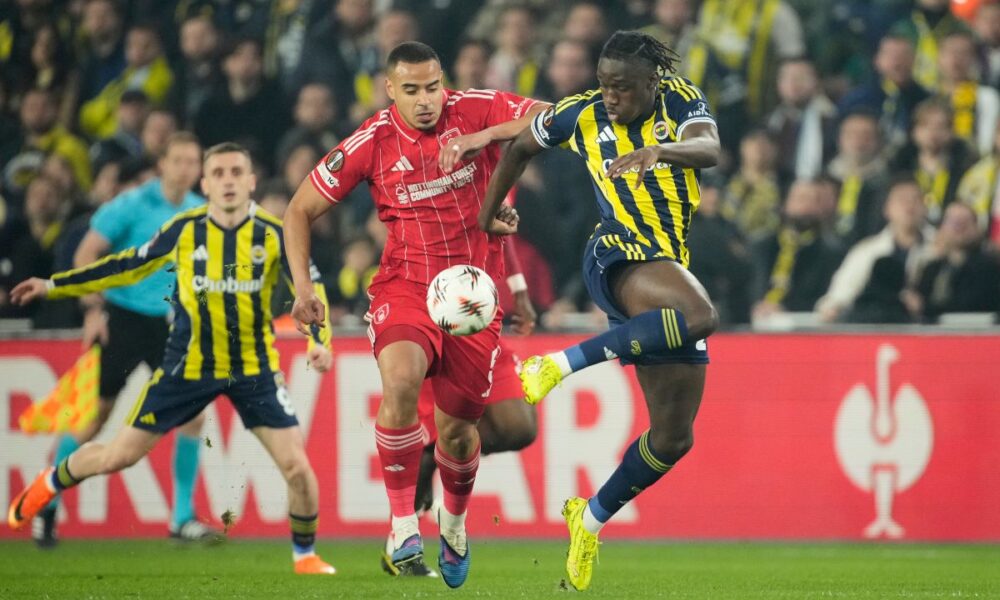 Fenerbahce's Sidiki Cherif, right, and Nottingham Forest's Murillo fight for the ball during a Europa league play-off first leg soccer match between Fenerbahce and Nottingham Forest in Istanbul, Turkey, Thursday, Feb. 19, 2026. (AP Photo/Emrah Gurel)