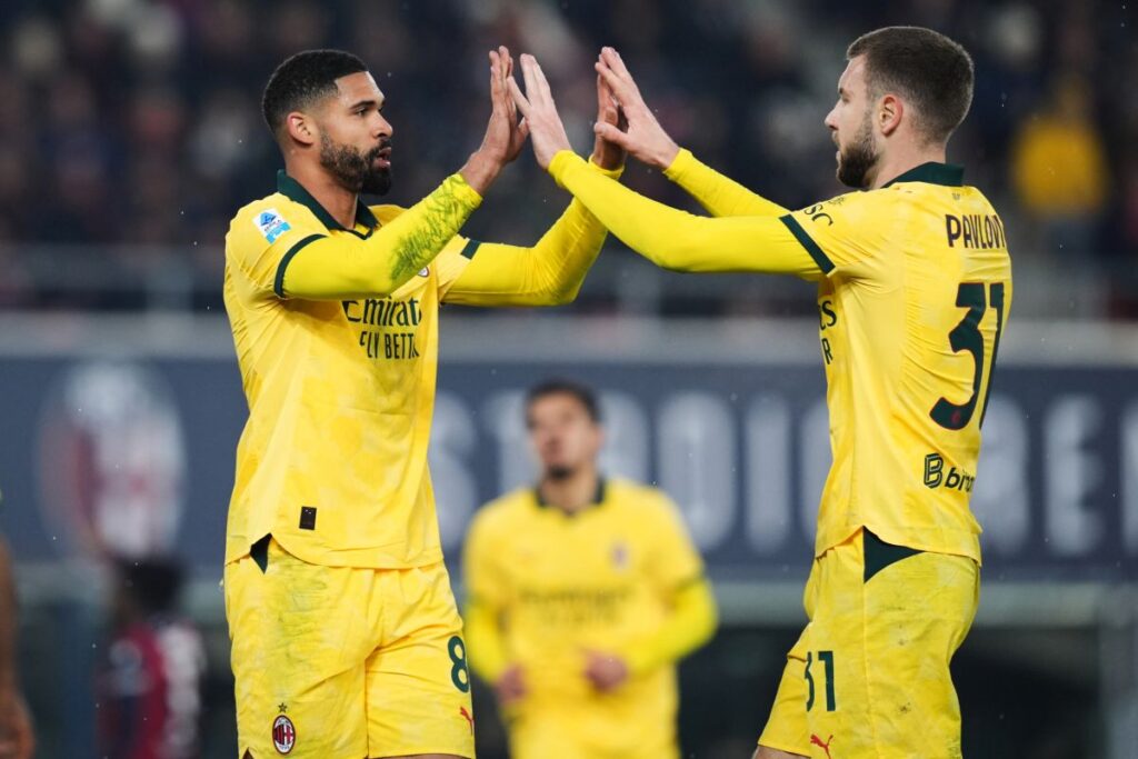 AC Milan's Ruben Loftus-Cheek, left, celebrates with Strahinja Pavlovic after scoring a goal during the Serie A soccer match between Bologna and Milan in Bologna, Italy, Tuesday Feb. 3, 2026. (Massimo Paolone/LaPresse via AP)