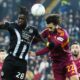 Udinese's Oumar Solet, left, fights for the ball with Roma's Mario Hermoso during the Serie A soccer match between Udinese and Roma at the Bluenergy Stadium in Udine, Italy, Monday, Feb. 2, 2026. (Andrea Bressanutti/LaPresse via AP)