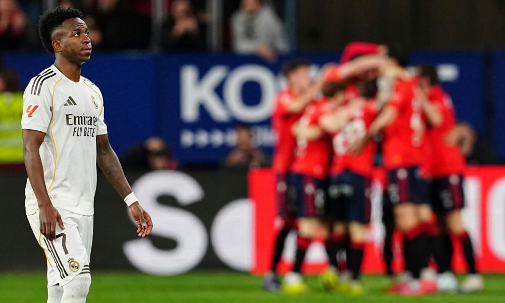 Real Madrid's Vinicius Junior reacts after Osasuna's Ante Budimir scored from a penalty kick during a Spanish La Liga soccer match between Osasuna and Real Madrid in Pamplona, Spain, Saturday, Feb. 21, 2026. (AP Photo/Miguel Oses)