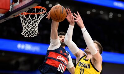 Washington Wizards forward Tristan Vukcevic (00) blocks Indiana Pacers center Micah Potter (11) during the first half of an NBA basketball game, Friday, Feb. 20, 2026, in Washington. (AP Photo/Nick Wass)