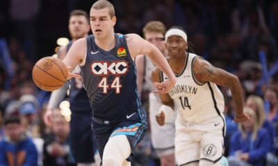 Oklahoma City Thunder guard Nikola Topic (44) leads a fast break in front of Brooklyn Nets guard Terance Mann (14) during the second half of an NBA basketball game Friday, Feb. 20, 2026, in Oklahoma City. (AP Photo/Nate Billings)
