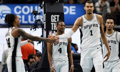 San Antonio Spurs guard Devin Vassell, left, celebrates with forward Victor Wembanyama (1) after scoring against the Detroit Pistons during the second half of an NBA basketball game Monday, Feb. 23, 2026, in Detroit. (AP Photo/Duane Burleson)