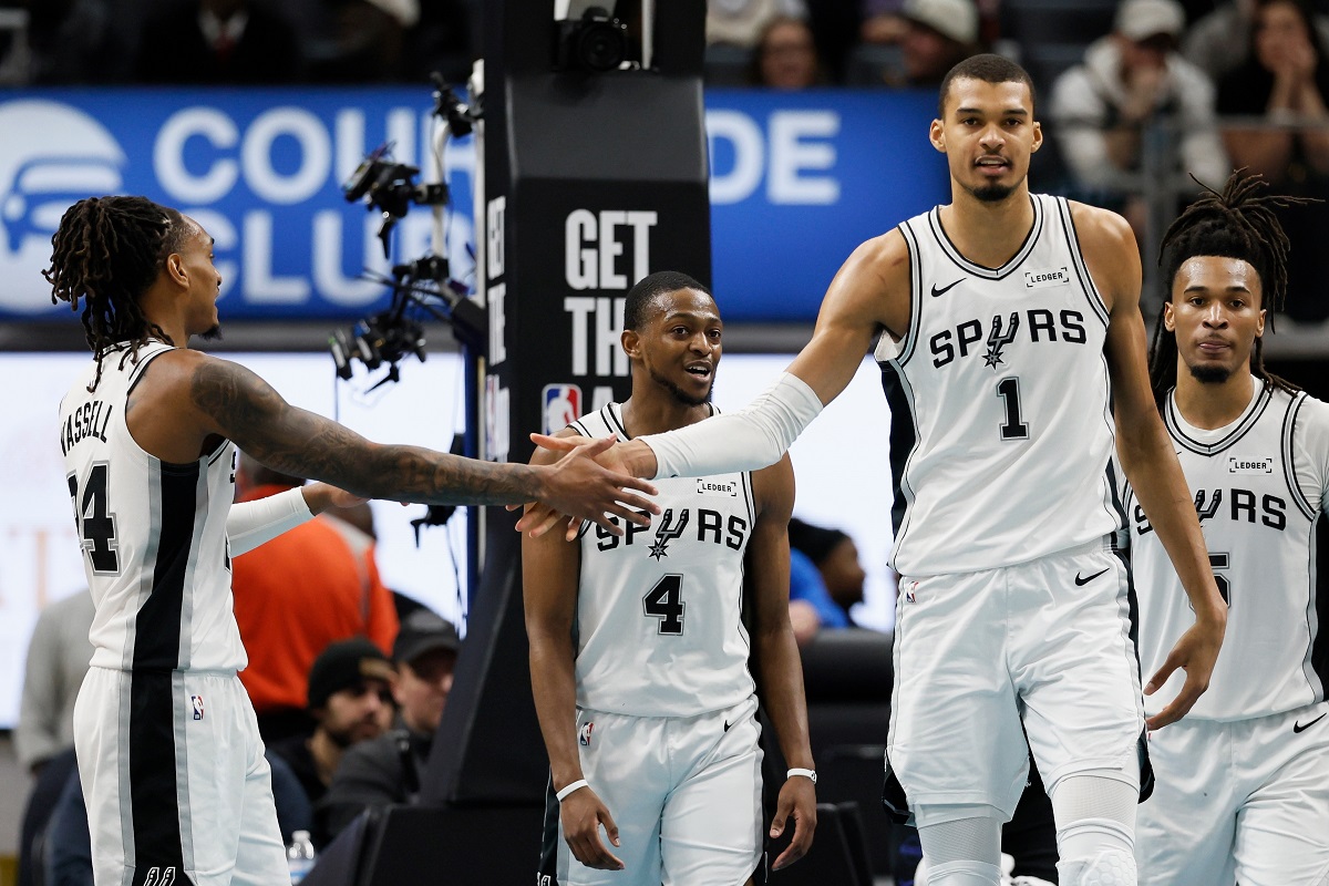 San Antonio Spurs guard Devin Vassell, left, celebrates with forward Victor Wembanyama (1) after scoring against the Detroit Pistons during the second half of an NBA basketball game Monday, Feb. 23, 2026, in Detroit. (AP Photo/Duane Burleson)