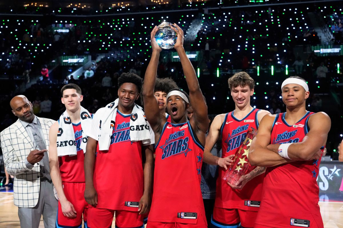 Members of Team Vince hold up their trophies after they defeated Team Melo in a final in NBA basketball's Rising Stars event Friday, Feb. 13, 2026, in Inglewood, Calif. (AP Photo/Mark J. Terrill)
