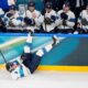 Finland's Roope Hintz, bottom, falls during a preliminary round match of men's ice hockey between Slovakia and Finland at the 2026 Winter Olympics, in Milan, Italy, Wednesday, Feb. 11, 2026. (AP Photo/Petr David Josek)