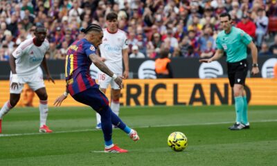 Barcelona's Raphinha scores on a penalty kick during the Spanish La Liga soccer match between Barcelona and Sevilla in Barcelona, Spain, Sunday, March 15, 2026. (AP Photo/Joan Monfort)