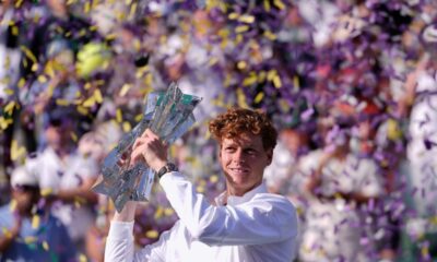 Jannik Sinner, of Italy, holds the winner's trophy after defeating Daniil Medvedev, of Russia, right, during a final match at the BNP Paribas Open tennis tournament, Sunday, March 15, 2026, in Indian Wells, Calif. (AP Photo/Mark J. Terrill)