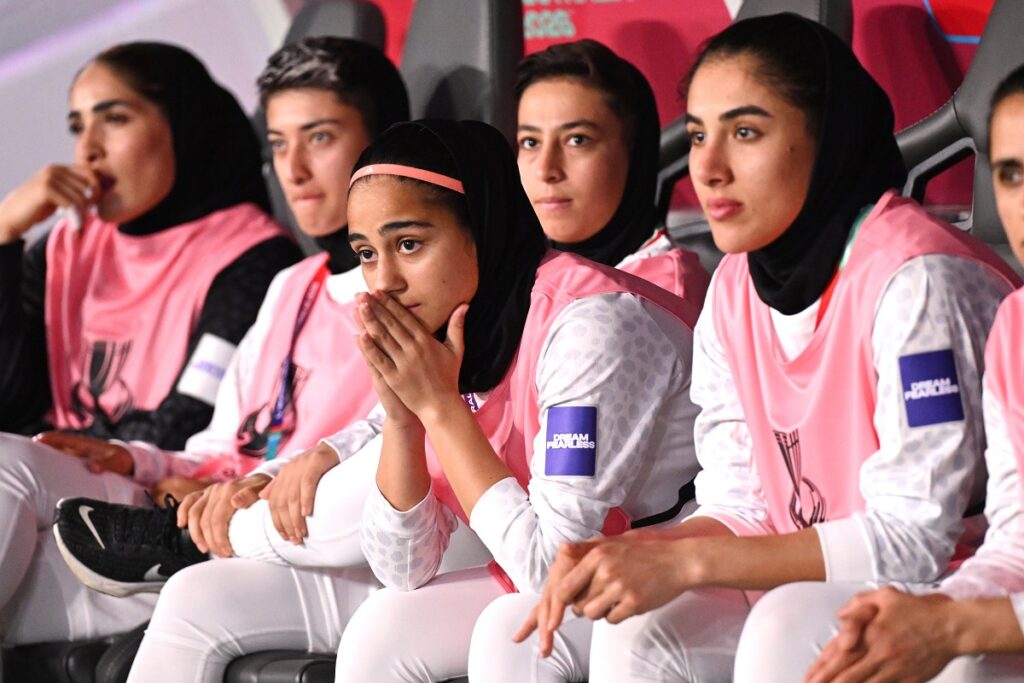 Iranian players react from the bench during the Women's Asia Cup soccer match between Iran and South Korea on the Gold Coast, Australia, Monday, March 2, 2026. (Dave Hunt/AAPImage via AP)
