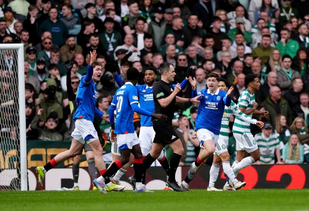 Rangers players appeal for a hand ball, during the Scottish Cup quarterfinal soccer match between Rangers and Celtic, in Glasgow, Scotland, Sunday March 8, 2026. (Andrew Milligan/PA via AP)