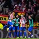 Atletico Madrid's Julian Alvarez, left, celebrates with teammates after scoring his side's fifth goal during the first leg of the Champions League round of 16 soccer match between Atletico Madrid and Tottenham in Madrid, Spain, Tuesday, March 10, 2026. (AP Photo/Jose Breton)
