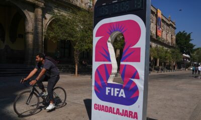 A cyclist rides past an installation promoting the FIFA World Cup 2026 in Guadalajara, Mexico, Wednesday, Feb. 25, 2026. (AP Photo/Marco Ugarte)