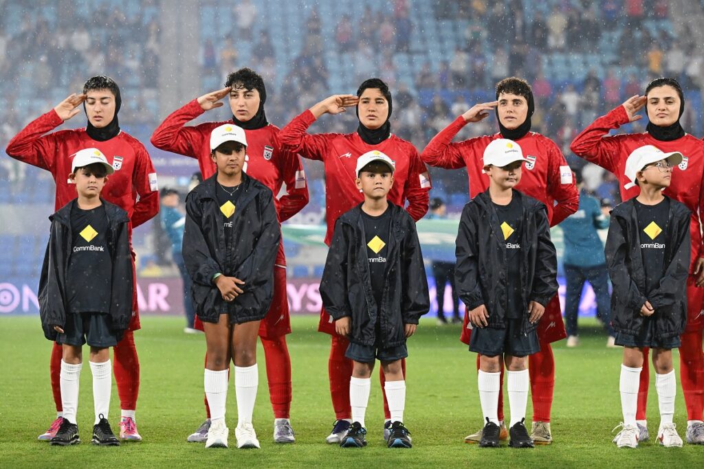 FILE - Iran players react during their national anthem ahead of the Women's Asian Cup soccer match between Iran and the Philippines in Robina, Australia, Sunday, March 8, 2026. (Dave Hunt/AAPImage via AP,File)