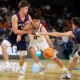Illinois guard Andrej Stojakovic drives to the basket between Pennsylvania forward Michael Zanoni and guard AJ Levine during the second half in the first round of the NCAA college basketball tournament, Thursday, March 19, 2026, in Greenville, S.C. (AP Photo/Chris Carlson)