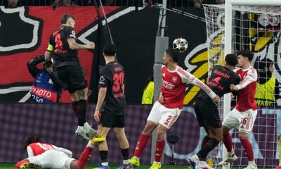 Leverkusen's Robert Andrich, left top, scores the opening goal of his team during the Champions League round of 16 first leg soccer match between Bayer Leverkusen and Arsenal FC in Leverkusen, Germany, Wednesday, March 11, 2026. (AP Photo/Martin Meissner)