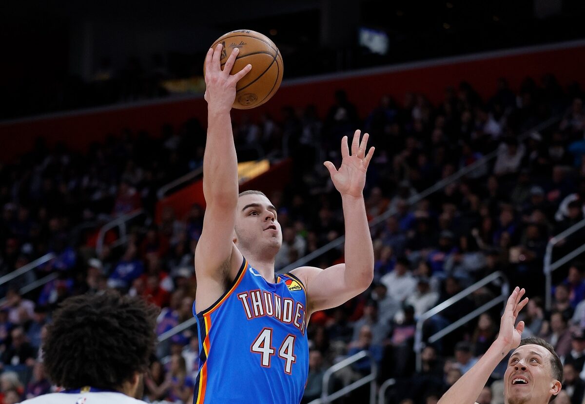 Oklahoma City Thunder guard Nikola Topic (44) goes to the basket between Detroit Pistons guard Cade Cunningham (2) and forward Duncan Robinson (55) during the second half of an NBA basketball game, Wednesday, Feb. 25, 2026, in Detroit. (AP Photo/Duane Burleson)