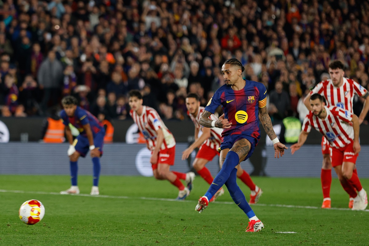 Barcelona's Raphinha scores from the penalty spot his side's second goal during the Copa del Rey semifinal second leg soccer match between Barcelona and Atletico Madrid in Barcelona, Spain, Tuesday, March 3, 2026. (AP Photo/Joan Monfort)
