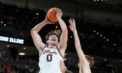 Illinois forward David Mirkovic (0) looks to pass during the first half in the first round of the NCAA college basketball tournament against Pennsylvania, Thursday, March 19, 2026, in Greenville, S.C. (AP Photo/Brynn Anderson)