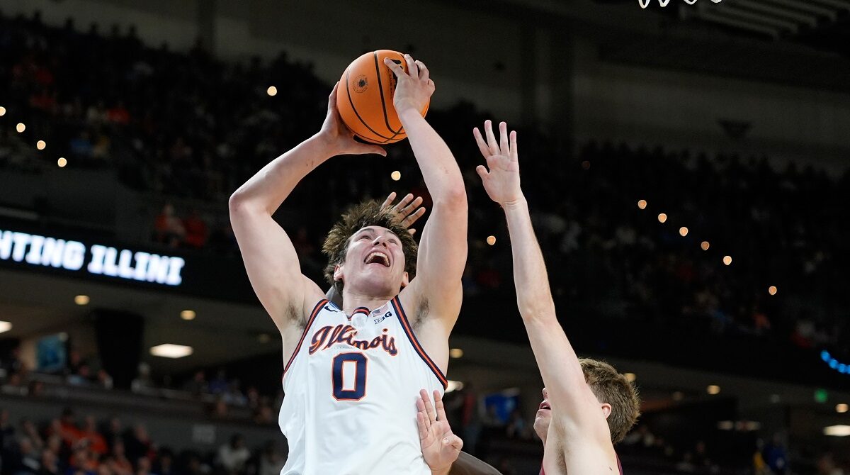 Illinois forward David Mirkovic (0) looks to pass during the first half in the first round of the NCAA college basketball tournament against Pennsylvania, Thursday, March 19, 2026, in Greenville, S.C. (AP Photo/Brynn Anderson)