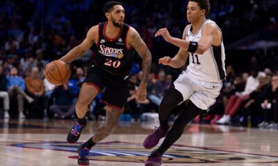 Philadelphia 76ers' Cameron Payne, left, drives to the basket against San Antonio Spurs' Carter Bryant, right, during the second half of an NBA basketball game, Tuesday, March 3, 2026, in Philadelphia. (AP Photo/Chris Szagola)