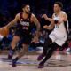 Philadelphia 76ers' Cameron Payne, left, drives to the basket against San Antonio Spurs' Carter Bryant, right, during the second half of an NBA basketball game, Tuesday, March 3, 2026, in Philadelphia. (AP Photo/Chris Szagola)