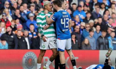 Celtic's Julian Araujo, center left and Rangers' Nicolas Raskin clash, during the Scottish Cup quarterfinal soccer match between Rangers and Celtic, in Glasgow, Scotland, Sunday March 8, 2026. (Steve Welsh/PA via AP)