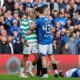 Celtic's Julian Araujo, center left and Rangers' Nicolas Raskin clash, during the Scottish Cup quarterfinal soccer match between Rangers and Celtic, in Glasgow, Scotland, Sunday March 8, 2026. (Steve Welsh/PA via AP)