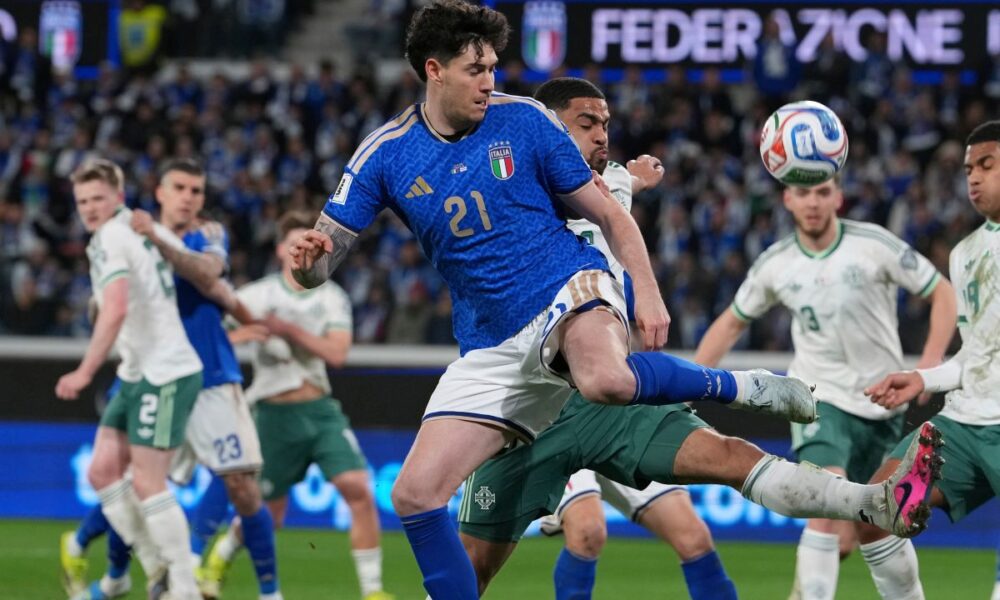 Italy's Alessandro Bastoni, front, and Northern Ireland's Shea Charles vie for the ball during the World Cup qualifying play-off soccer match between Italy and Northern Ireland, in Bergamo, Italy, Thursday, March 26, 2026. (AP Photo/Antonio Calanni)