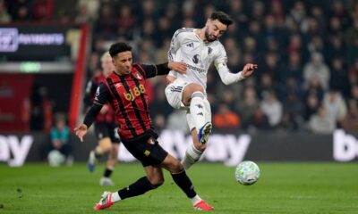Bournemouth's James Hill, left, and Manchester United's Bruno Fernandes battle for the ball during an Premier League soccer match, Friday, March 20, 2026, in Bournemouth, England. (Andrew Matthews/PA via AP)