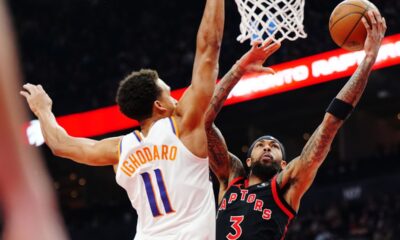 Toronto Raptors' Brandon Ingram (3) shoots past Phoenix Suns' Oso Ighodaro (11) during the first half of an NBA basketball game in Toronto, Friday, March 13, 2026. (Frank Gunn/The Canadian Press via AP)