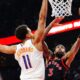 Toronto Raptors' Brandon Ingram (3) shoots past Phoenix Suns' Oso Ighodaro (11) during the first half of an NBA basketball game in Toronto, Friday, March 13, 2026. (Frank Gunn/The Canadian Press via AP)