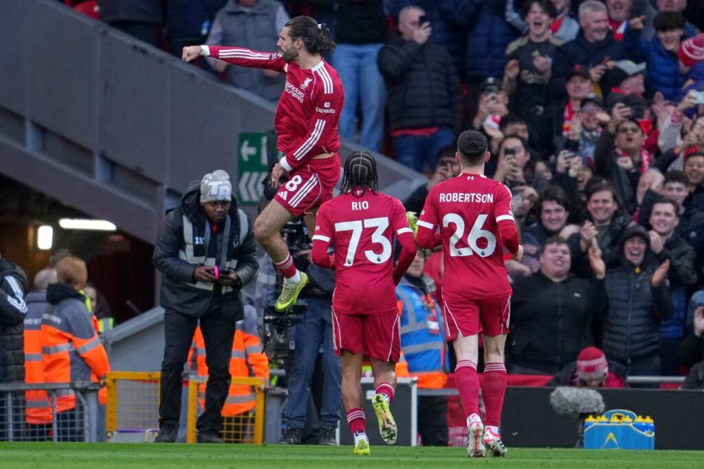 Liverpool's Dominik Szoboszlai celebrates after scoring during the Premier League soccer match between Liverpool and Tottenham in Liverpool, England, Sunday, March 15, 2026. (AP Photo/Jon Super)