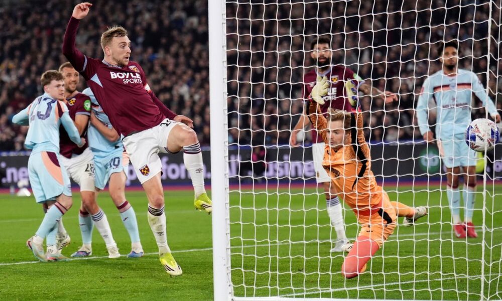 West Ham United's Jarrod Bowen scores during the English FA Cup fifth round soccer match between West Ham United and Brentford in London, Monday March 9, 2026. (John Walton/PA via AP)