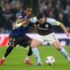 Lille's Nathan Ngoy, left, and Aston Villa's John McGinn, right, challenge for the ball during the Europa League round of sixteen second leg soccer match between Aston Villa and LOSC Lille in Birmingham, England, Thursday, March 19, 2026. (David Davies/PA via AP)
