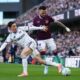 Fulham's Harry Wilson and Burnley's Quilindschy Hartman, right, battle for the ball during the Premier League match between Fulham and Burnley, in London, Saturday March 21, 2026. (John Walton/PA via AP)