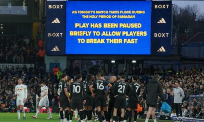Players stand during a pause as observing Muslim players break the Ramadan fast during the Premier League soccer match between Leeds United and Manchester City in Leeds, England, Saturday, Feb. 28, 2026. (AP Photo/Ian Hodgson)