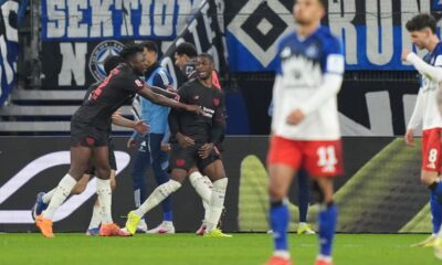 Leverkusen's Christian Kofane, centre, celebrates after scoring during the Bundesliga soccer match between Hamburger SV and Bayer Leverkusen, in Hamburg, Germany, Wednesday March 4, 2026. (Marcus Brandt/dpa via AP)