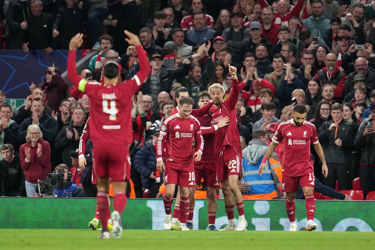Liverpool's Hugo Ekitike celebrates with teammates after scoring his side's second goal during the second leg of the Champions League round of 16 soccer match between Liverpool and Galatasaray, in Liverpool, England, Wednesday, March 18, 2026. (AP Photo/Jon Super)