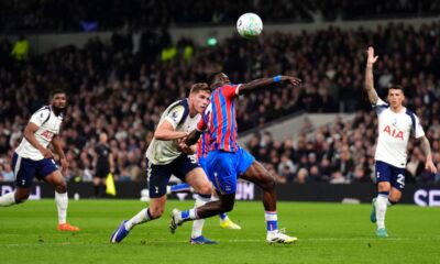 Tottenham Hotspur's Micky van de Ven, center left, fouls Crystal Palace's Ismaila Sarr resulting in a red card and a penalty during the English Premier League soccer match between Tottenham Hotspur and Crystal Palace in London, Thursday March 5, 2026. (John Walton/PA via AP)