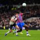 Tottenham Hotspur's Micky van de Ven, center left, fouls Crystal Palace's Ismaila Sarr resulting in a red card and a penalty during the English Premier League soccer match between Tottenham Hotspur and Crystal Palace in London, Thursday March 5, 2026. (John Walton/PA via AP)