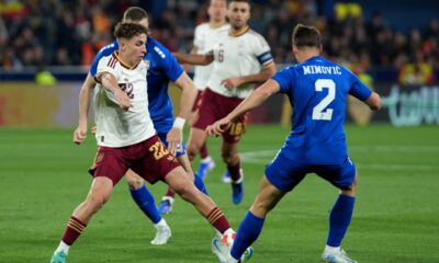 Spain's Fermin Lopez, left, and Serbia's Ognjen Mimovic challenge for the ball during the international friendly soccer match between Spain and Serbia in Villarreal, Spain, Friday, March 27, 2026. (AP Photo/Alberto Saiz)