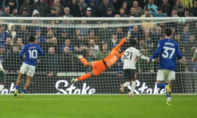 Everton's Iliman Ndiaye, left, scores his side's third goal past Chelsea's goalkeeper Robert Sanchez during the English Premier League soccer match between Everton and Chelsea in Liverpool, England, Saturday, March 21, 2026. (AP Photo/Jon Super)