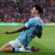 Manchester City's Nico O'Reilly celebrates after scoring the opening goal during the English League Cup final soccer match between Arsenal and Manchester City in London, Sunday, March 22, 2026. (AP Photo/Richard Pelham)